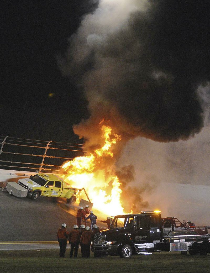 Fuel in a jet dryer burns after Juan Pablo Montoya’s car slid sideways and struck it during last year’s Daytona 500. The fire stopped the event for two hours as workers put out the fire and then tried to repair the track. 