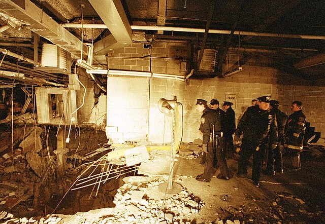 FILE - In this file photo of Feb. 27, 1993, police and firefighters inspect the bomb creater inside an underground parking garage of New York's World Trade Center the day after an explosion tore through it. Twenty years ago next week, a group of terrorists blew up explosives under one of the towers, killing six people and ushering in an era of terrorism on American soil.(AP Photo/Richard Drew, File)
