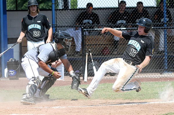 Will Jibas, left, provides Bentonville’s baseball team with experience at two positions this spring as the junior split his time at catcher and at third base last season. 