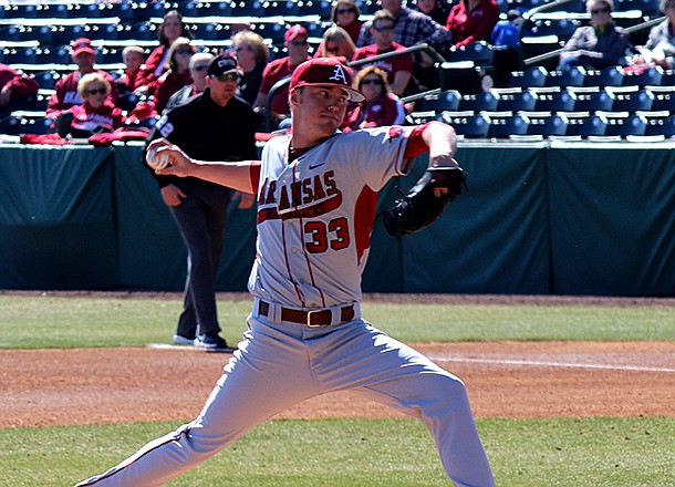 Trey Killian delivers a pitch during Arkansas' 10-2 win over Evansville on Feb. 24, 2012 at Baum Stadium in Fayetteville. 