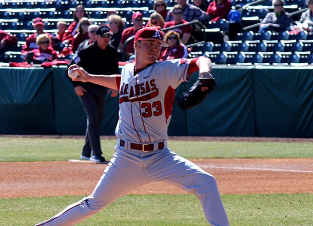 Trey Killian delivers a pitch during Arkansas' 10-2 win over Evansville on Feb. 24, 2012 at Baum Stadium in Fayetteville. 