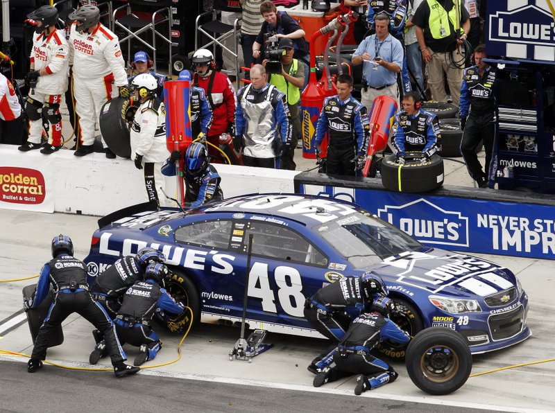 Jimmie Johnson pits for tires and fuel during the NASCAR Daytona 500 Sprint Cup Series auto race at Daytona International Speedway, Sunday, Feb. 24, 2013, in Daytona Beach, Fla.