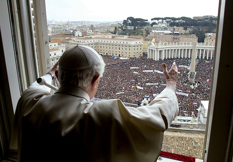 Pope Benedict XVI delivers his blessing during his last Angelus noon prayer from the window of his studio overlooking St. Peter’s Square at the Vatican on Sunday. 
