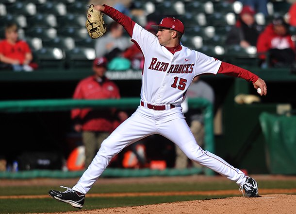 Arkansas pitcher Colin Poche fires a pitch during the first game of Tuesday afternoon's doubleheader against New Orleans at Baum Stadium in Fayetteville.