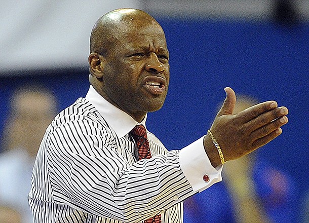 Arkansas coach Mike Anderson react to a call during the second half of an NCAA college basketball game against Florida in Gainesville, Fla., Saturday, Feb. 23, 2013. Florida won 71-54. (AP Photo/Phil Sandlin)