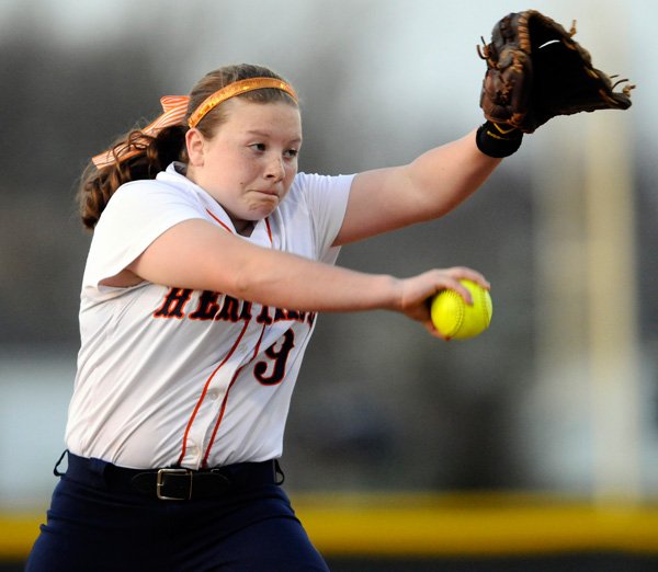 Dasha Donahoe, Rogers Heritage’s starting pitcher, delivers a pitch during the Lady War Eagles’ game March 1 against Huntsville at Veterans Park in Rogers. 