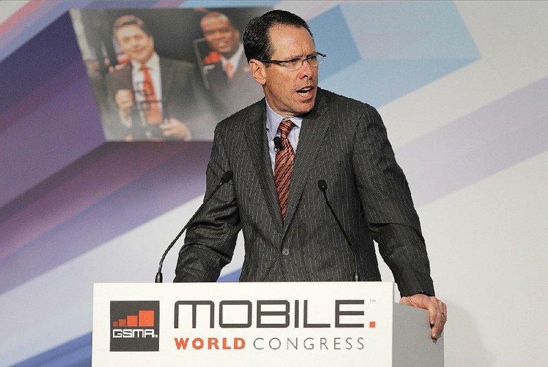 Randall Stephenson, chairman, president and chief executive officer of AT&T Inc., makes the opening address at the Mobile World Congress in Barcelona, Spain, on Monday. AT&T will take over General Motors’ OnStar service in the 2015 model year. 