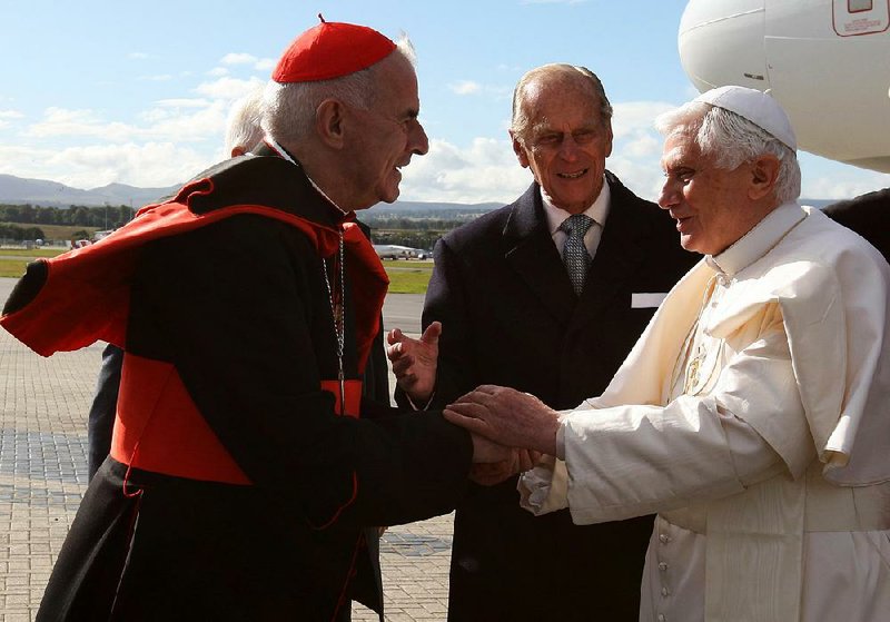 Pope Benedict XVI is greeted by Cardinal Keith O’Brien (left) in Edinburgh, Scotland, on Sept. 16, 2010. 