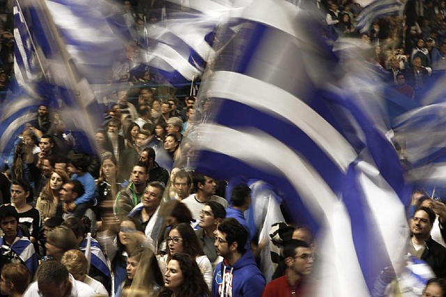 Supporters of newly elected president Nicos Anastasiades celebrate his victory in Nicosia, Cyprus, on Sunday. 