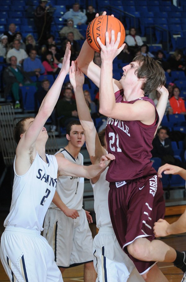 Ricky Scott, right, of Huntsville is bigger and stronger than last season, but has improved vastly because his teammate, Cole Frick, has looked for more ways to get the 6-foot-6 center involved in the Eagles’ offense. 