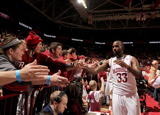 Arkansas junior Marshawn Powell (33) celebrates with fans after defeating Georgia Thursday, Feb. 21, 2013 at Bud Walton Arena in Fayetteville. The Razorbacks won 62-60.