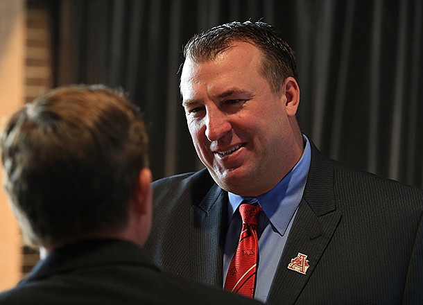 Razorback football coach Bret Bielema greets fans before a Razorback Day at the Capitol lunch in Little Rock. 