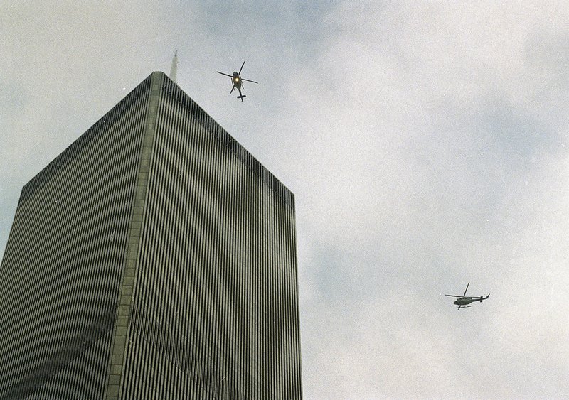 In this file photo of Feb. 26, 1993, helicopters jockey for position over the World Trade Center in New York following a noontime blast, which rocked the twin towers complex. 