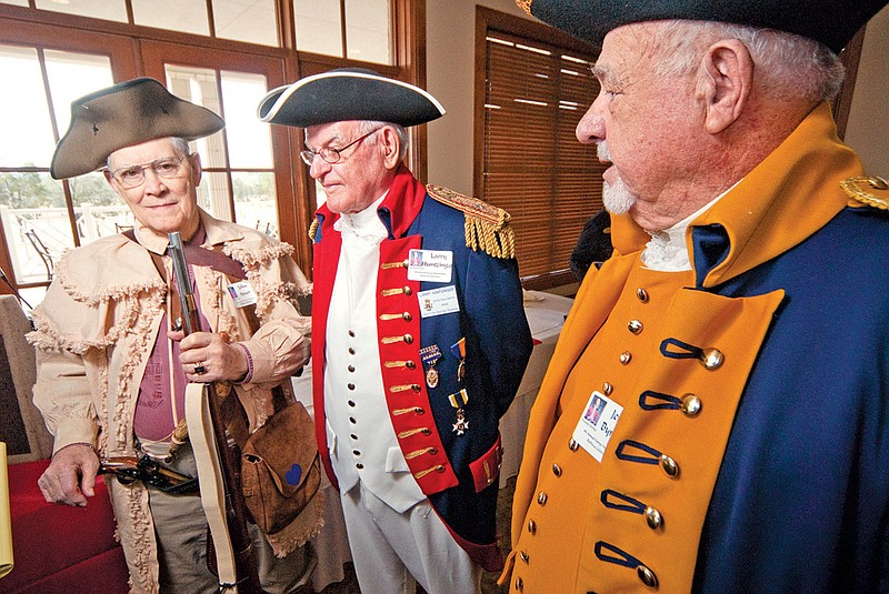 From the left, John Speer, Larry Huntzinger and Jerry Byrum appear in period costume for a celebration of George Washington’s birthday in Hot Springs.