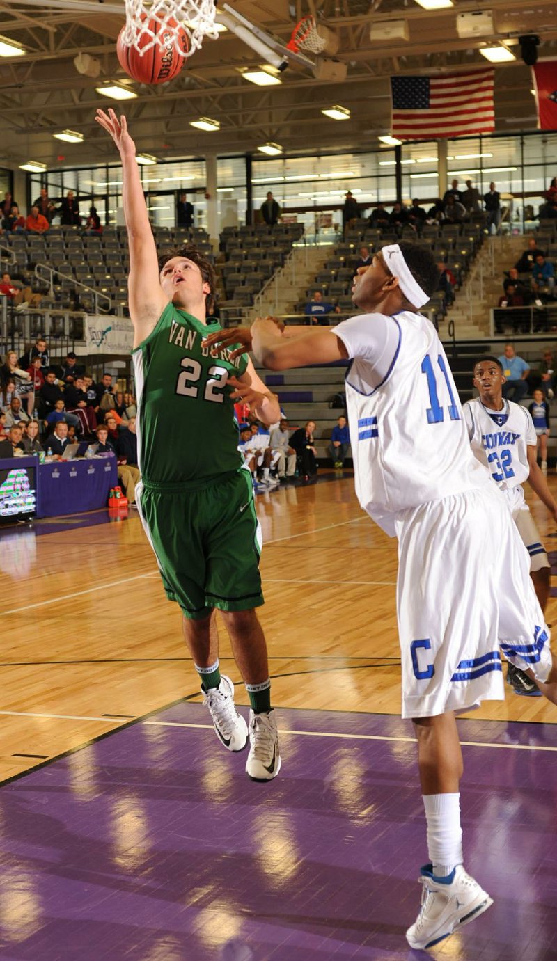 NWA Media/ANDY SHUPE
Van Buren senior Nicholas Pagel (22) takes a shot in tine lane as Conway senior Justin Leon (11) Wednesday, Feb. 27, 2013, during the second half of play in the first round of the Class 7A State Basketball Tournament at Fayetteville High School.