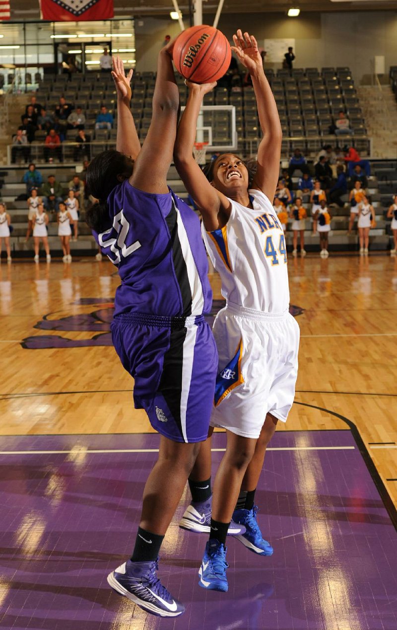 NWA Media/ANDY SHUPE
North Little Rock junior forward Kiara Webb (44) is fouled by Fayetteville senior forward Brittany Austin Wednesday, Feb. 27, 2013, during the first half of play in the first round of the Class 7A State Basketball Tournament at Fayetteville High School.