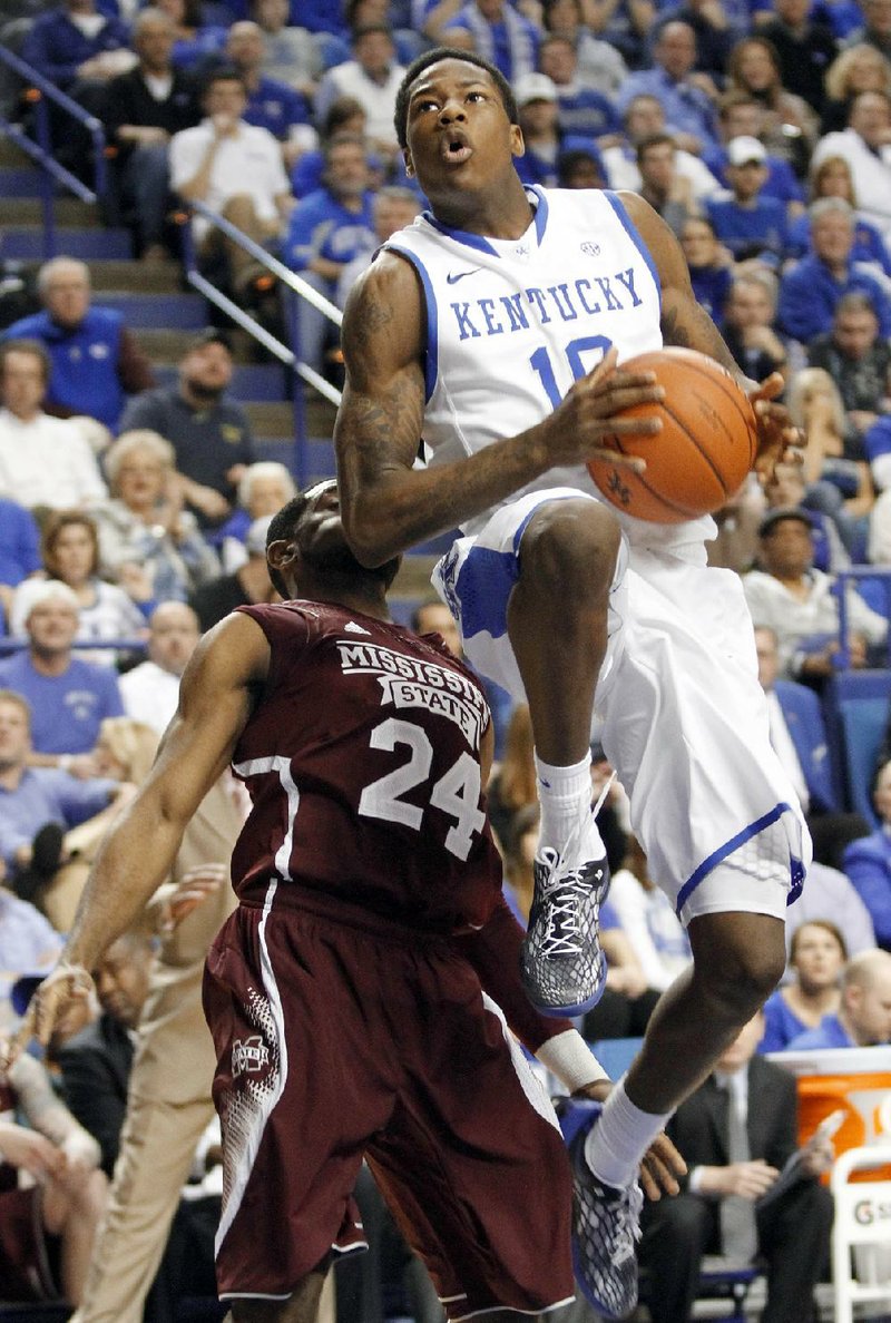 Kentucky's Archie Goodwin goes to the basket in fornt of Mississippi State's Tyson Cunningham during the first half of an NCAA college basketball game at Rupp Arena in Lexington, Ky., Wednesday, Feb. 27, 2013. (AP Photo/James Crisp)