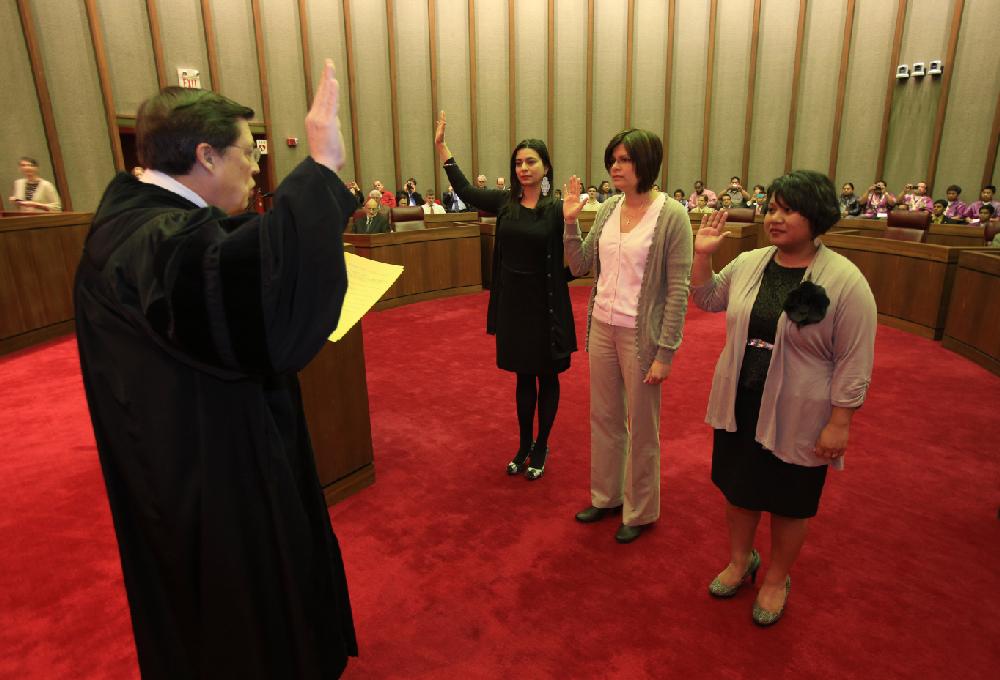 Arkansas Democrat-Gazette/STATON BREIDENTHAL --2/28/13-- Arkansas Chief Justice Jim Hannah (left) swears in new certified state court  interpreters (left to right) Jivette M. de Jesus Rullan (cq), Ines Yahaira Fernandez Ortiz (cq), and Melisa Laelan Thursday morning in the Supreme Court courtroom. Laelan is the first person in the country to be sworn in as a certified Marshallese interpreter.