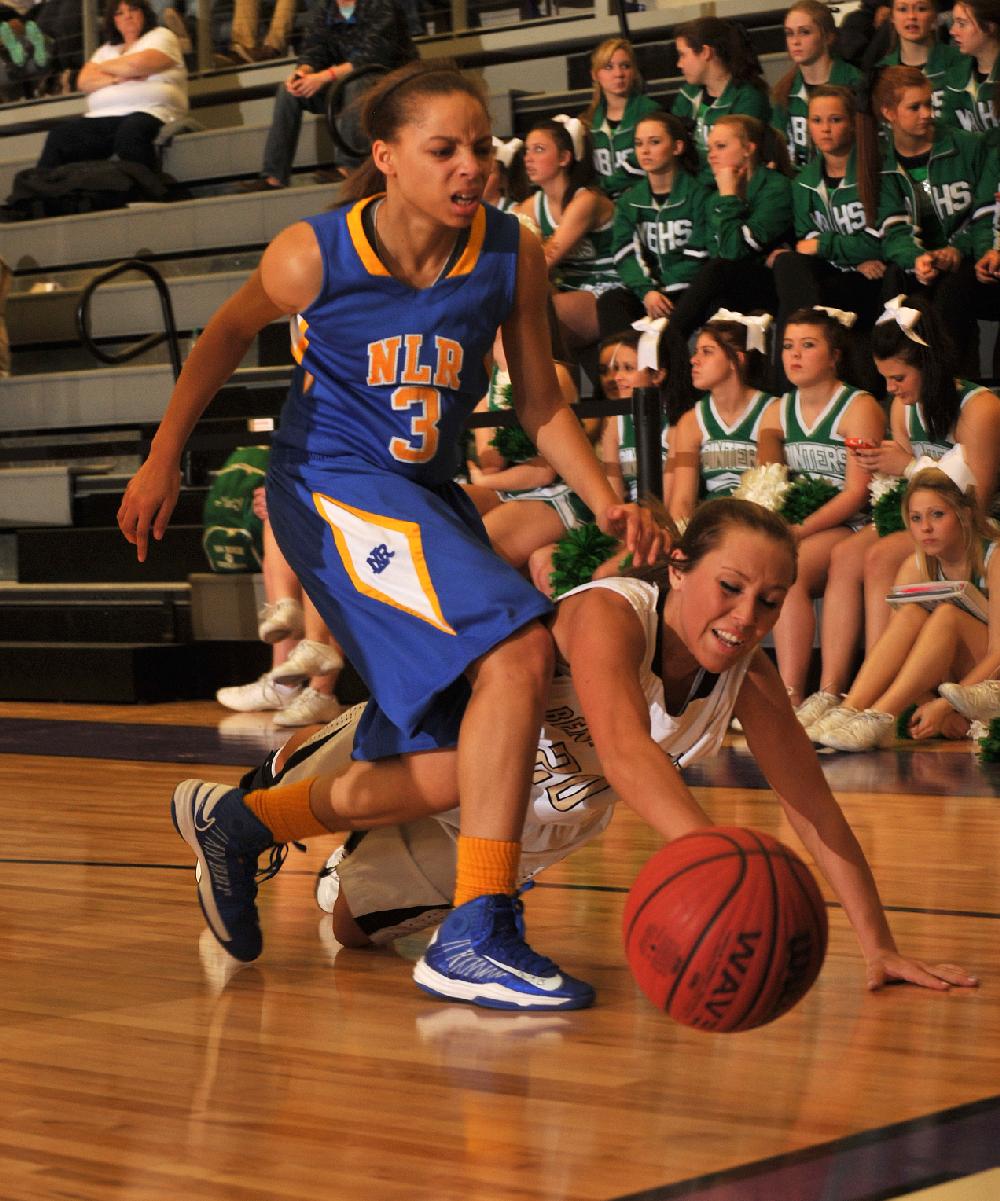 NWA Media/MICHAEL WOODS --02/22/2013-- Bentonville's Brooke Mabeus and North Little Rocks Dajha Hardamon go after a loose ball during the second half of Thursday evenings game in the girls 7A state basketball tournament in Fayetteville.