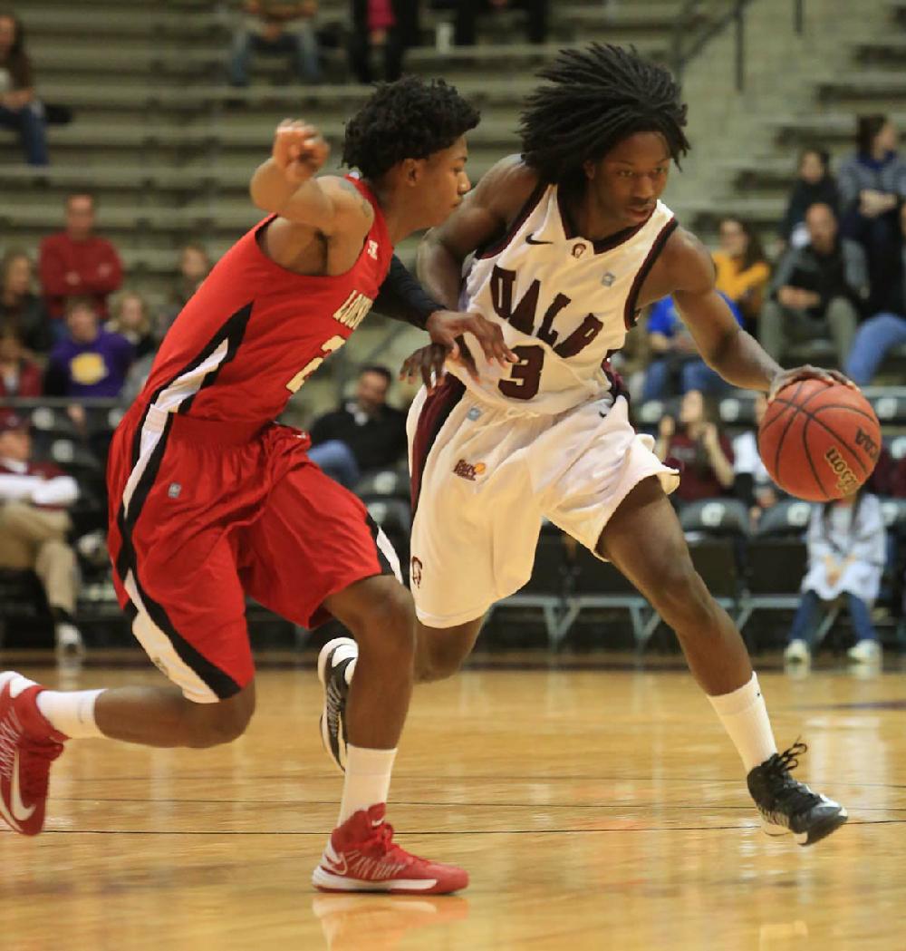 Arkansas Democrat-Gazette/RICK MCFARLAND --02/28/13-- UALR's Josh Hagins (3) dribbles around Louisianna Lafayette's Elfrid Payton in their game at the Jack Stephen's Center in Little Rock Thursday.