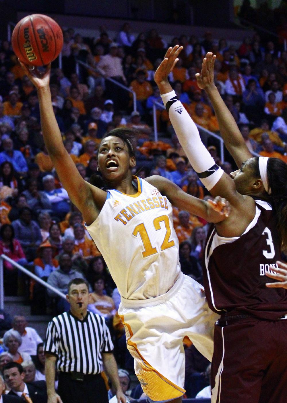 Tennessee center Bashaara Graves (12) shoots past Texas A&M center Kelsey Bone (3) in the second half of an NCAA college basketball game, Thursday, Feb. 28, 2013, in Knoxville, Tenn. Tennessee won 82-72 to clinch its 17th Southeastern Conference regular-season title outright. (AP Photo/Wade Payne)