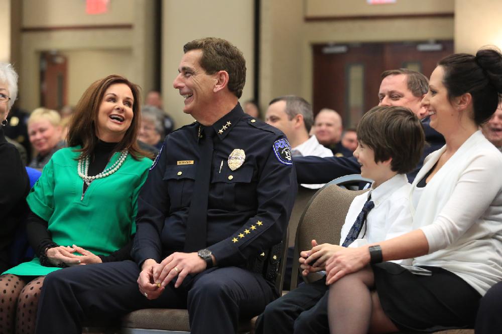 Arkansas Democrat-Gazette/RICK MCFARLAND --02/28/13--  North Little Rock Police Chief Danny Bradley laughs along with his wife Melonie (left), grandson Tristan, and daughter Brandi during an event at the Hays Center Thursday to honor Bradley who is retiring effective Mar. 1. Bradley will now become the chief of staff for North Little Rock Mayor Joe Smith.