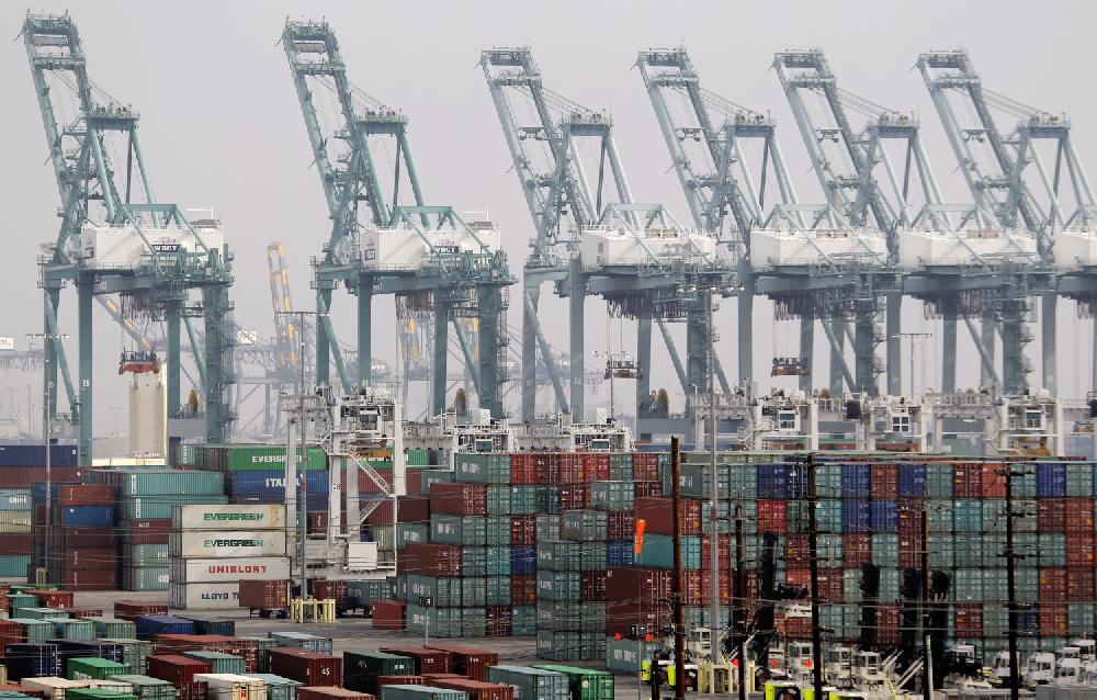FILE- In this Tuesday, Dec. 4, 2012, file photo, shipping containers are seen as port operations are halted during a strike at the Port of Los Angeles. The U.S. economy grew at a 0.1 percent annual rate from October through December, the weakest performance in nearly two years. But economists believe a steady housing rebound and solid spending by consumers and businesses are pushing growth higher in the current quarter. (AP Photo/Nick Ut, File)
