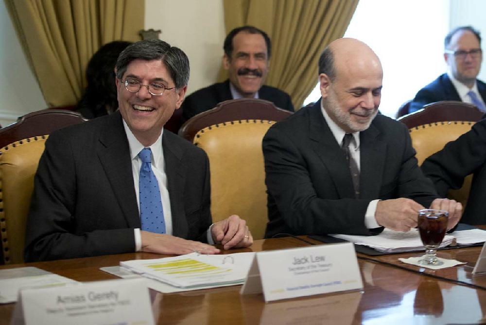 Treasury Secretary Jack Lew, left, accompanied by Federal Reserve Chairman Ben Bernanke, smile before his first meeting as Treasury Secretary, Thursday, Feb. 28, 2013, at the Treasury Department in Washington. (AP Photo/Carolyn Kaster)