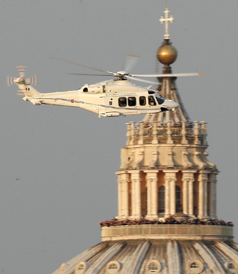 A helicopter with Pope Benedict XVI onboard leaves the Vatican in Rome, Thursday, Feb. 28, 2013. The 85-year-old German Pope Benedict is stepping down on Thursday evening, the first pope to do so in 600 years, after saying he no longer has the mental or physical strength to vigorously lead the world's 1.2 billion Catholics. (AP Photo/Michael Sohn)