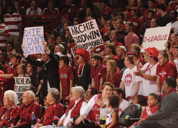 Arkansas fans hold signs directed at Little Rock native and Kentucky freshman guard Archie Goodwin during the first half of play Saturday, March 2, 2013, in Bud Walton Arena in Fayetteville.