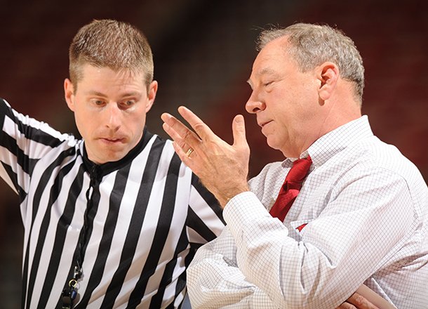 Arkansas coach Tom Collen speaks to an official during the second half against South Carolina Sunday, Jan. 27, 2013, in Bud Walton Arena.