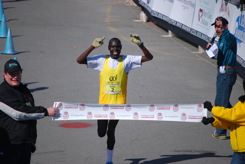 Mark Chepses crossed the finish line to win his third Little Rock Marathon in a row.