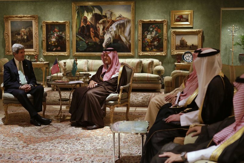 U.S. Secretary of State John Kerry, left, meets with Saudi Foreign Minister Prince Saud al-Faisal in his palace in Riyadh, Saudi Arabia on Sunday, March 3, 2013. Saudi Arabia is the seventh leg of Kerry's first official overseas trip.