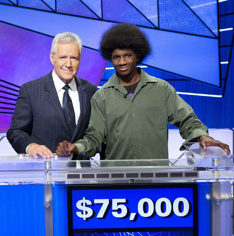 Alex Trebek (left) and Leonard Cooper smile on the set of Jeopardy! 