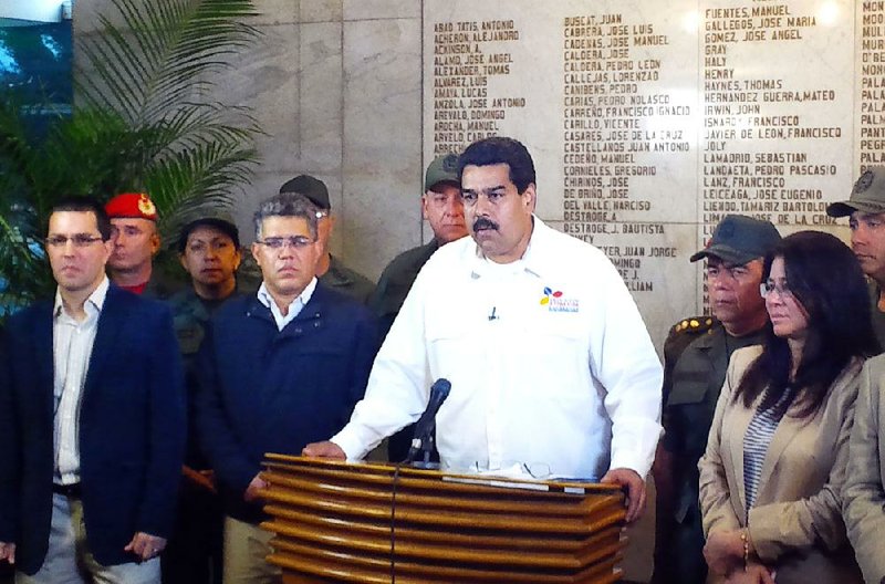 In this photo released by Miraflores Presidential Press Office, Venezuela's Vice President Nicolas Maduro addresses the nation to announce the death of President Hugo Chavez in Caracas, Venezuela, Tuesday, March 5, 2013. Maduro announced that Chavez has died on Tuesday at age 58 after a nearly two-year bout with cancer. (AP Photo/Miraflores Presidential Press Office)