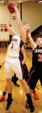 Tara Arnold, guarded by Whitney DeWitt, takes a shot during season play on Feb. 5. 