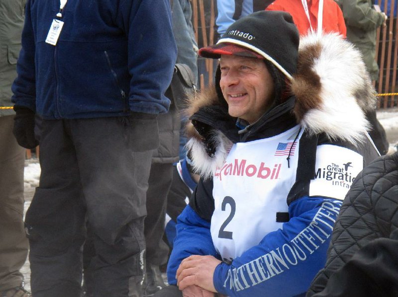 Four-time champion Martin Buser earned a good meal after finishing the first half of the Iditarod Dog Sled Race nearly eight hours ahead of the field. 