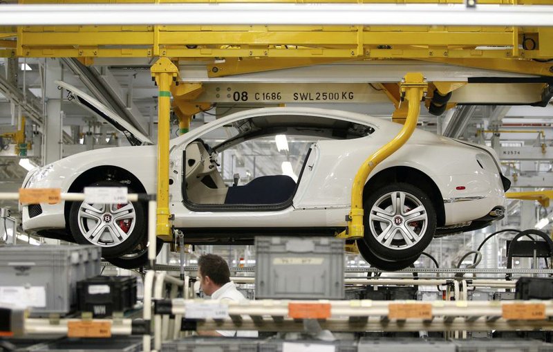 A Bentley Continental GT moves along the production line Thursday at the Bentley Motors Ltd. plant in Crewe, England. Bentley unveiled its updated $200,000 Continental Flying Spur in Geneva this week. 