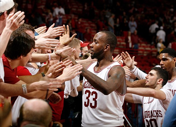Arkansas junior Marshawn Powell and teammates celebrate with fans following their 73-62 win over Texas A&M on Saturday, March 9, 2013, at Bud Walton Arena in Fayetteville. 