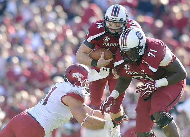 Arkansas defender Austin Flynn makes the tackle on South Carolina quarterback Connor Shaw during the Razorbacks' 38 - 20 loss to the Gamecocks on Saturday, Nov. 10, 2012 at Williams-Brice Stadium in Columbia, S.C.