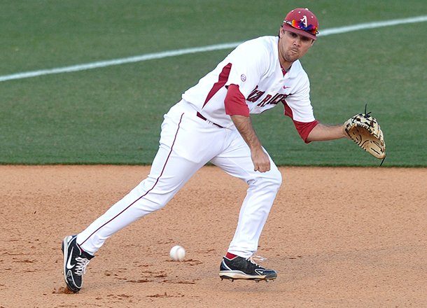 Arkansas third baseman Jacob Mahan runs down a ground ball in the first inning of Tuesday night's game against Alabama A&M at Baum Stadium in Fayetteville.