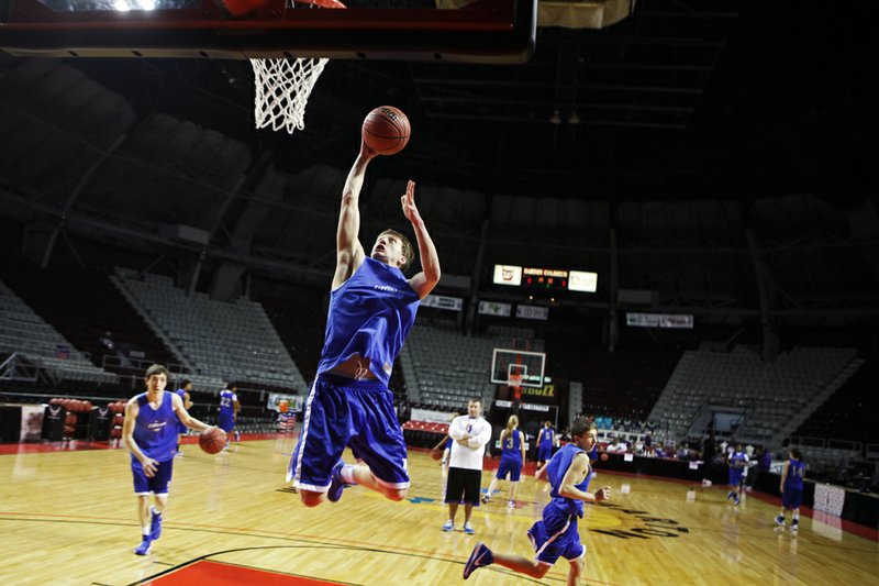 Cade Crabtree, a freshman at Cedar Ridge High School, practices in Barton Coliseum in preparation for the Class 2A state championship game. Crabtrees' brother Cole also starts for the team.