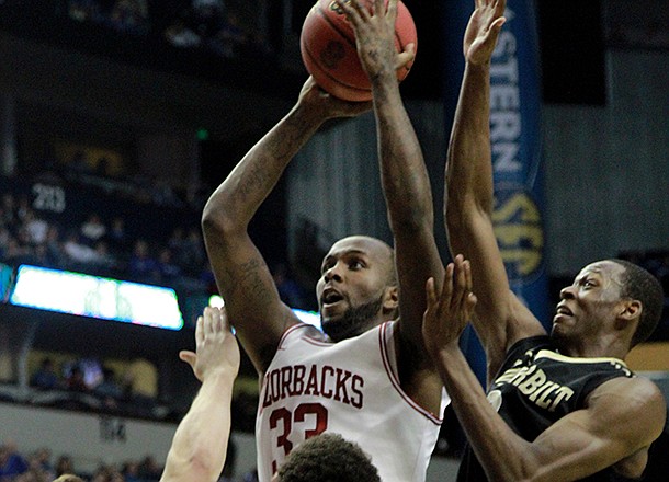 Arkansas's Marshawn Powell shoots over Vanderbilt defenders Shelby Moats, Kendren Johnson and Rod Odom during their Southeastern Conference tournament game in Nashville Thursday.