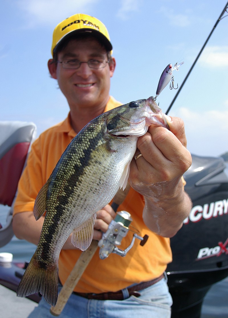 Undersized lures like this mini-crankbait often catch bass when bigger enticements fail. Jeff Samsel of Clarksville, Ga., caught this spotted bass in Lake Ouachita.