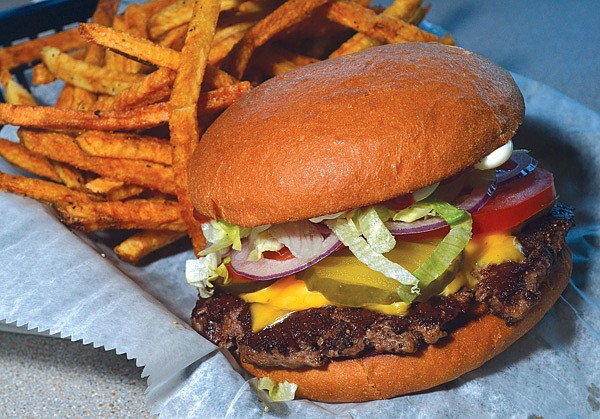 Although just recently opened, The Burger Patti in west Fayetteville serves a classic-style burger, packaged here with house-made French fries.