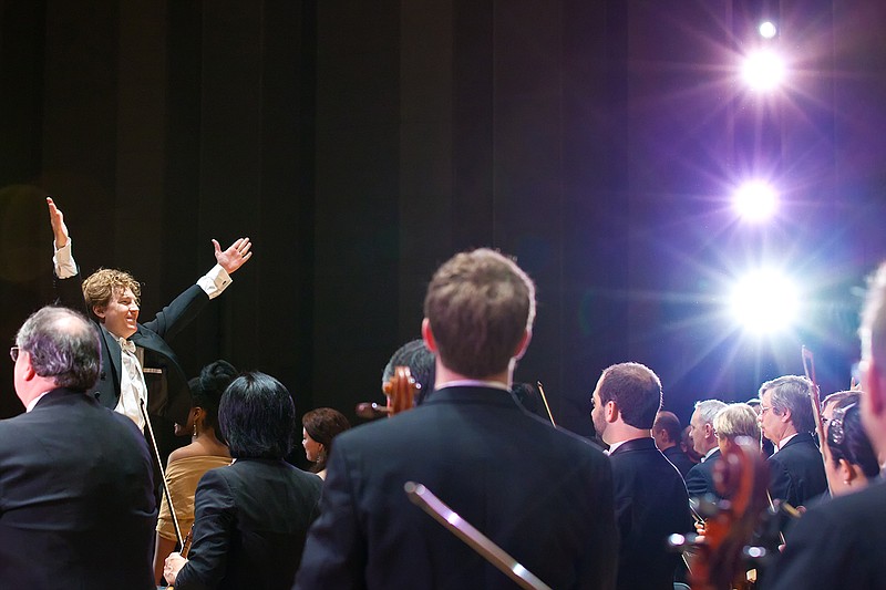 Philip Mann, music director of the Arkansas Symphony Orchestra, and the orchestra receive a standing ovation following a March 8 concert in Jones Performing Arts Center at Ouachita Baptist University in Arkadelphia. The performance featured the music of W. Francis McBeth, an internationally acclaimed composer and conductor and longtime professor of music at OBU. McBeth died last year at age 78.