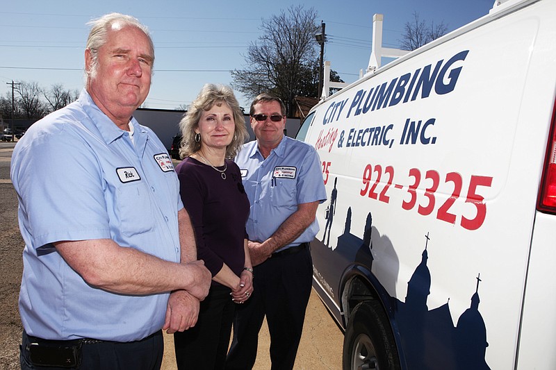 Rick Bonte, from the left, Elwen Guthrie and Ronnie Carroll, owners of City Plumbing, Heating & Electric Inc. in Hot Springs, donate $1,150 of the company’s money to charity every month.