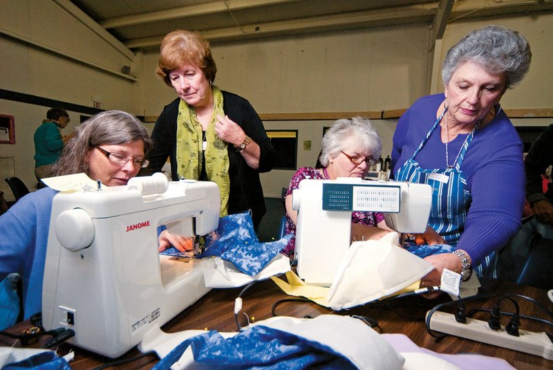 From the left, Rebecca Manus, Ruth Hook, Karen Warner and Linda Dingley participate in a sewing party at Greenbrier Church of the Nazarene to make care caps for cancer patients.