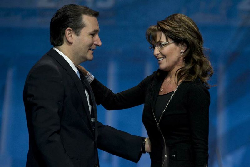 Sen. Ted Cruz (left) of Texas greets former Alaska Gov. Sarah Palin after introducing her Saturday at the Conservative Political Action Conference in National Harbor, Md. 