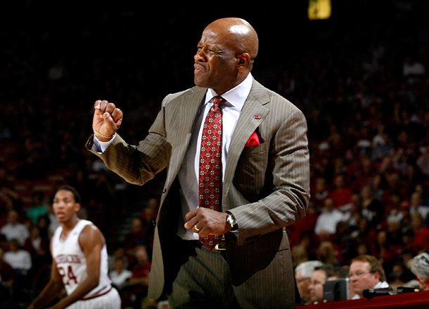Arkansas head coach Mike Anderson signals to his players during the second half against Texas A&M on Saturday, March 9, 2013, at Bud Walton Arena in Fayetteville.